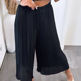 Maya | Pantaloni plisati Melnas — confort ușor și croială elegantă