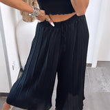 Maya | Pantaloni plisati Melnas — confort ușor și croială elegantă